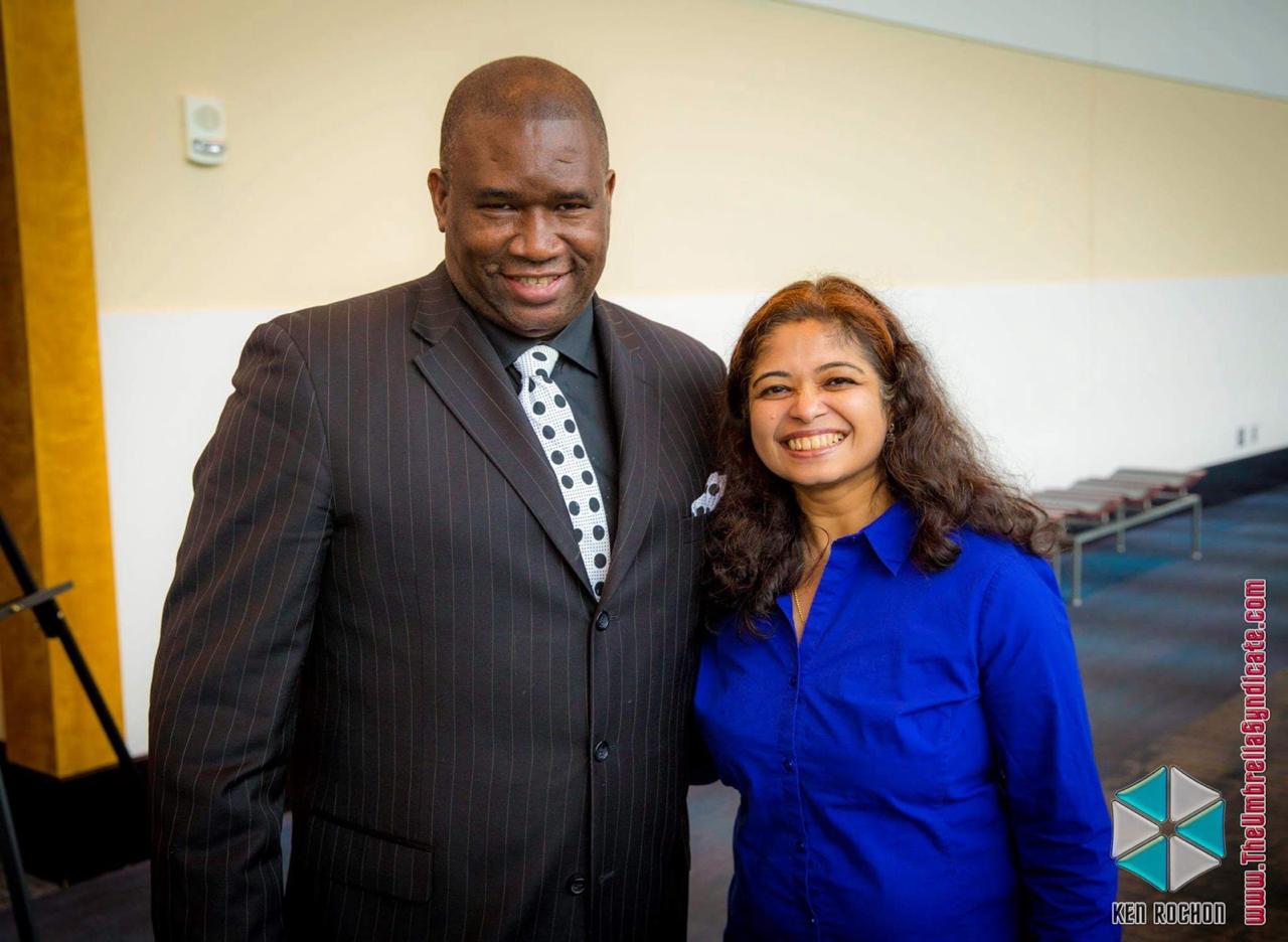 Geetha Krishnan with a keynote speaker at a professional event