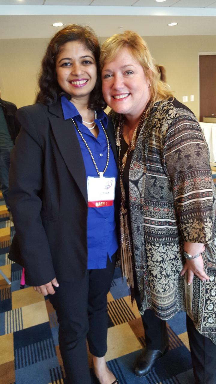 Geetha Krishnan with a fellow attendee at a conference